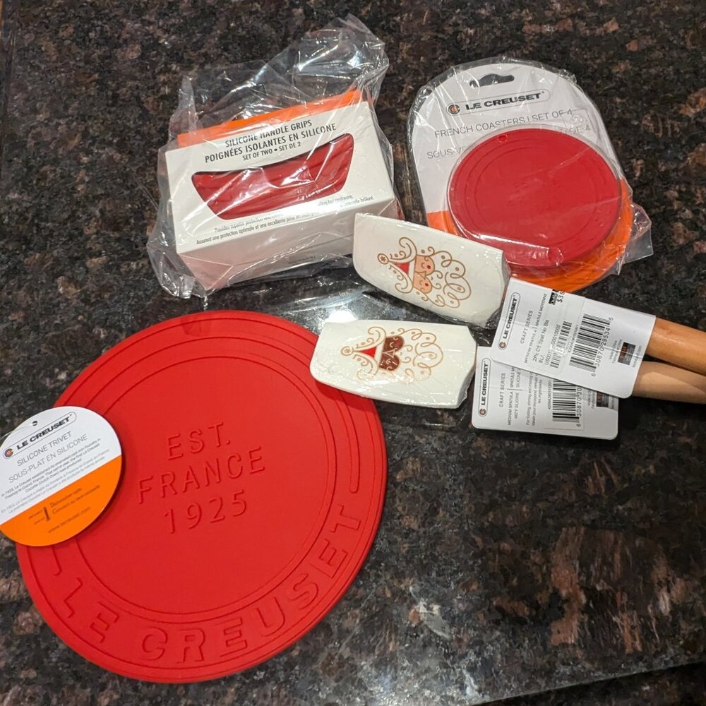Cerise Nine Piece Le Creuset Silicone Trivet, Coasters, Pot Grips, & Spatulas